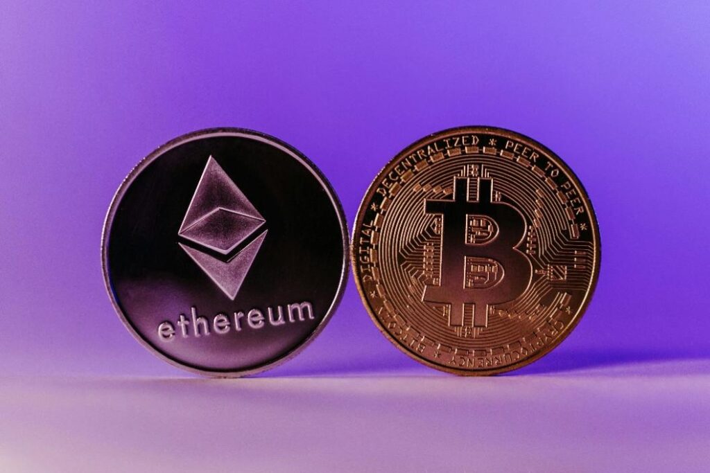Bitcoin and Ethereum coins positioned in front of a purple background
